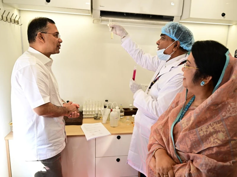 PM inspects mobile food testing laboratory