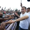 Feni crowds brave rain for PM’s glimpse